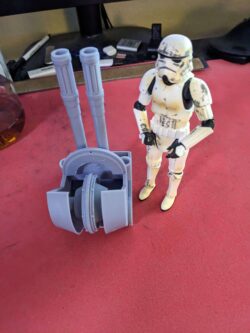 The chin cannon for the 6 inch scale AT-ST project standing next to a 6 inch scale stormtrooper figure.