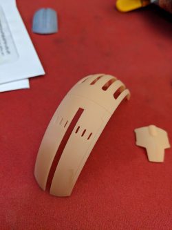 First version of the back shell. This proved to be a bad design. A week after the print came off the printer, the back fingers all curled inwards. I have since redesigned it a bit thicker with ribbing and it doesn't curl now.