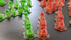 Perspective photograph of 1:12 scale red and green Holocrons