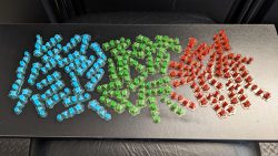 Top down photograph of 1:12 scale blue, green and red Holocrons