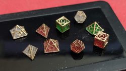 Perspective photograph 2 of 1:12 scale red, green and white Holocrons that have had their edges painted gold.