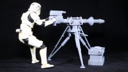 Side view of unpainted E-Web blaster with posed 1:12th (6 inch) scale Remnant Stormtrooper.