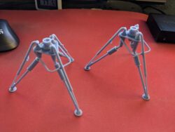 Side by Side comparison of old tripod assembly (left) vs new tripod assembly (right) for the new E-Web Heavy Repeating Blaster 3D print
