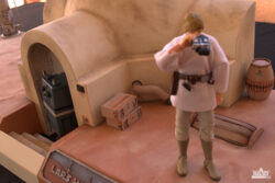Shot of Luke Skywalker scanning the horizon for his lost Astromech.