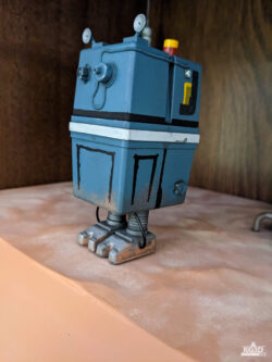 Photo showing front and left sides of painted GNK power droid, with straight legs.