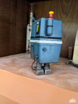 Photo showing back side of painted GNK power droid, with straight legs.