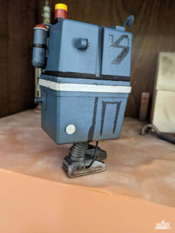 Photo showing right side of painted GNK power droid, with Left foot forward