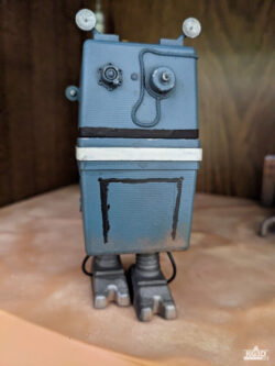 Photo showing front side of painted GNK power droid, with Left foot forward