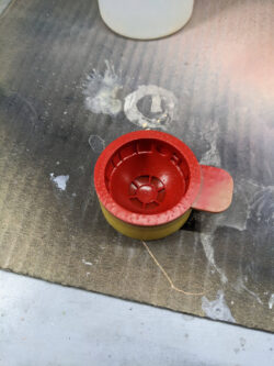 The inside of the paint mask after painting, before removing the panted dome.